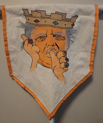 Embroidered banner shows Trump as Prince John from Disney's Robin Hood